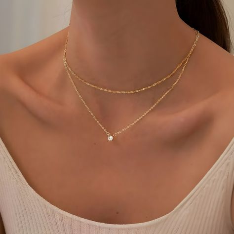 ✨ Discover the epitome of luxury with our enchanting Golden Diamond Pendant Necklace 💎, a must-have accessory for the modern woman who values elegance and grace. Handcrafted to perfection, this exquisite necklace combines the timeless allure of gold 🌟 with the captivating brilliance of a brilliant-cut diamond 💫. Indulge in the glamour and sophistication of this statement piece, meticulously designed to complement any outfit, from casual chic to formal elegance. Whether you're attending a roma Chic Gold Jewelry, Minimalistic Gold Jewelry, Golden Chain Designs For Women, Gold Chain Designs For Women, Golden Necklaces, Elegant Gold Necklace, Diamond Necklace Gift, Golden Accessories, Floating Diamond Necklace