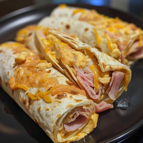 🌟 Crispy and melty! Try our Air Fryer Hot Chicken Ham and Cheese Wraps tonight! #QuickMeal 🍽️ Air Fryer Hot Chicken Ham and Cheese Wraps 🛒 Ingredients: 4 tortillas 1 cup cooked chicken, shredded 4 slices ham 1 cup cheddar cheese, shredded 1 tbsp hot sauce 👩‍🍳 Instructions: Layer: On each tortilla, layer chicken, ham, cheese, and a drizzle of hot sauce. Roll: Tightly roll up the tortillas. Cook: Place in air fryer at 380°F for 8 minutes. ✨ Enjoy: Dive into the crispy goodness of our Chicke... Air Fryer Hot Chicken, Ham And Cheese Wraps, Chicken Ham And Cheese, Cheese Wraps, Chicken Shredded, Layer Chicken, Tortilla Rolls, Chicken Ham, Instagram Recipes