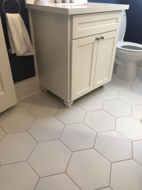 Octagon white tile bath floor with light gray grout to highlight the pattern. Accent with your favorite color. Hexagon Tile Mudroom Floor, Hexagon Tile With Dark Grout, White Hexagon Kitchen Floor, Octagonal Tile Floor, White Octogon Tiles Bathroom, Small White Hexagon Tile Bathroom, White Octagon Tile Bathroom, Octagon Tile Bathroom Floor, White Hexagon Tile Bathroom Floor