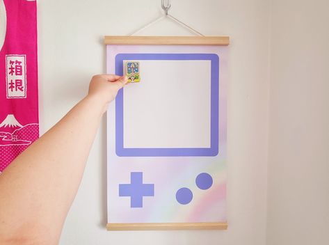 Purple Gameboy pin banner is a fun and stylish way to display your love of gaming. Perfect for gamers of all ages, this banner is made of high-quality pins and features a vibrant purple Gameboy design. Hang it on your wall, mantle, or anywhere else you want to show off your gaming pride! #gameconsole #gamer #gaming #gameroom . #Geeky_Living_Room #Patch_Display #Monster_Snacks #Banner_Game Sakura Snacks, Patch Display, Monster Snacks, Pins Display, Banner Game, Pin Banner, Mini Homes, Badge Display, Patches Display