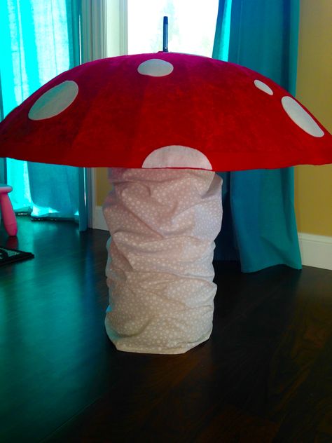 Extra Large 3 foot mushroom decoration.  Made from a cement tube, Beko 32" umbrella with 24 ribs, batting, stretch velvet, cream polka dot cotton for the base, and felt circles for the top.  There is also a weight, tied to the umbrella handle, in the base to prevent it from tipping over. Umbrella Mushroom, Mushroom Decor, Alice In Wonderland Party, Stretch Velvet, Wonderland Party, Alice In Wonderland, Bat, Umbrella, Polka Dots