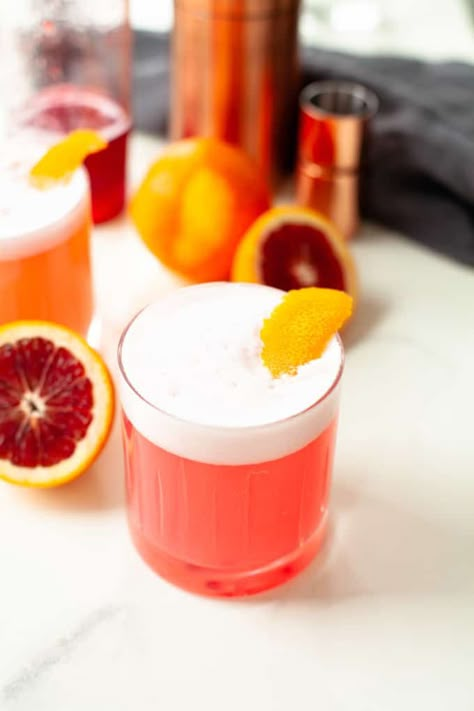 Delightfully refreshing and subtly sweet, this blood orange gin fizz cocktail is perfect for a date night or party! Blood Orange Soda Cocktail, Blood Orange Gin Cocktail, Orange Gin Fizz, Gin Drink Recipes, Orange Juice Cocktails, Orange Simple Syrup, Blood Orange Cocktail, Gin Fizz Cocktail, Fizz Cocktail