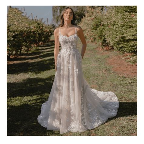 Step into your fairytale moment with this breathtaking Backless Boho Bridal Gown. Designed for the free-spirited bride, this stunning A-Line wedding dress gracefully combines romance and modern elegance. The timeless sweetheart neckline accentuates your natural beauty, while intricate floral lace appliques add a touch of ethereal charm. The flowing A-line silhouette flatters every figure, offering comfort and movement on your special day. With its captivating backless design, this gown exudes bo Loose Floral Wedding Dress Beige, Floral Embroidered Wedding Dress With Fitted Bodice, Flowy Wedding Dress With Floral Embroidery, Wedding Floor-length Maxi Dress With Floral Applique, A-line Wedding Dress With Floral Embroidery, Floral Embroidered Wedding Dress, Sweetheart Neckline Wedding Dress, Romantic A Line Wedding Dress, Cap Sleeve Wedding Dress