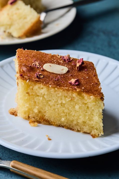 Revani as we call this sweet semolina cake in   Greek is basically a yellow sponge cake that gets steeped in a delicious   citrusy simple syrup. The sponge is fairly light with a nice crumb and   when soaked with the syrup it becomes a delight to eat. Ravani Greek Cake, Yellow Sponge Cake, Greek Cake, Carrot Cake Loaf, Cake Loaf, Semolina Cake, Greek Sweets, Dessert Smoothie, Arabic Sweets