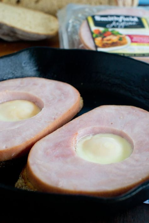 You’ve gotta try this Egg-in-a-Hole recipe with both bread and a juicy ham steak. It's a great quick, hearty one-pan breakfast that nobody can resist. SmithfieldFlavor AD Cooking Ham In Crockpot, Juicy Ham, Cook Ham, Ham Steak Recipes, Ham Steak, Egg In A Hole, Weekday Breakfast, Ham Steaks, How To Cook Ham