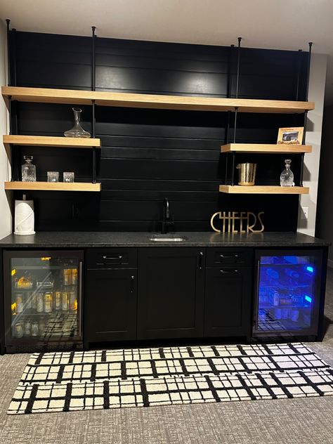 Black is back. Important to bring similar colors and styling throughout for a more cohesive home Basement Bar Black, Black Basement Bar, Shiplap Basement, Black Basement, Black Shiplap, Black Accent Walls, Black Counters, Bar Black, Behind Bars