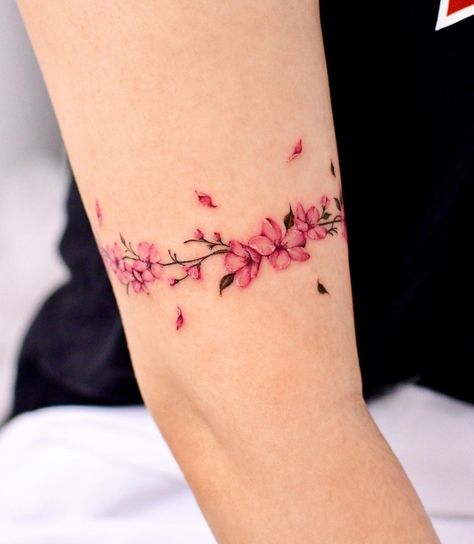 Pink Flower Arm Tattoo, Cherry Blossom Tattoo Shoulder, Arm Cuff Tattoo, Delicate Flower Tattoo, Tattoos To Cover Scars, Flower Wrist Tattoos, Anklet Tattoos, Tattoos For Women Flowers, Flower Tattoo Shoulder