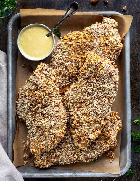 Pecan Crusted Chicken is tender, juicy chicken breasts coated with chopped pecans and panko breadcrumbs, served with a homemade honey mustard sauce. Adding the crunch from pecans and panko gives these chicken breasts somewhat of a fried texture, but baked in the oven. And then, the honey mustard sauce perfectly complements the chicken! (The sauce is SO GOOD, I could eat it on its own!) There is definitely a kick to this recipe, but you can also make it milder if preferred. Unique Fall Recipes, Pecan Crusted Chicken Breast, Homemade Honey Mustard Sauce, Pecan Crusted Chicken, Crusted Chicken Recipes, Honey Mustard Dipping Sauce, Homemade Honey Mustard, Pecan Chicken, Honey Mustard Sauce