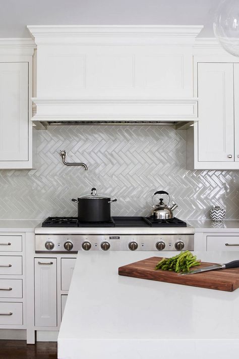 Transitional Kitchen With White Cabinets And Sleek Gray Ceramic Herringbone Backsplash Tiles Blue Herringbone Backsplash, Herringbone Tiles Kitchen, Herringbone Backsplash Kitchen, White Herringbone Backsplash, Marble Interior Design, Herringbone Tile Backsplash, Patterned Tile Backsplash, Marble Interior, Beadboard Backsplash