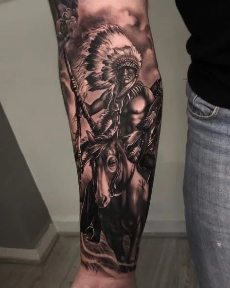 105+ Native American Tattoo Ideas To Honor Indigenous Heritage Native American Tattoos Back Piece, Native American Scenery Tattoo, Indian Themed Tattoos, Eagle Tattoo Native American, Native Neck Tattoo, Western Sleeve Tattoos For Guys, Indian Tomahawk Tattoo, Native Eagle Tattoo, Native American Back Tattoos