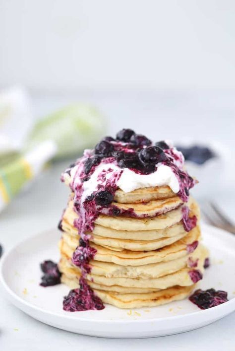 These lemon blueberry pancakes would be perfect for your spring brunch and weekend get-to-gathers. Fluffy buttermilk lemon pancakes are topped with a blueberry-thyme compote and whipped cream. #pancakes #blueberry Bougie Brunch, Fruit Kabob, Fluffy Blueberry Pancakes, Pizza Fruit, Lemon Blueberry Pancakes, Cream Pancakes, Lemon Pancakes, Spring Breakfast, Blueberry Pancake