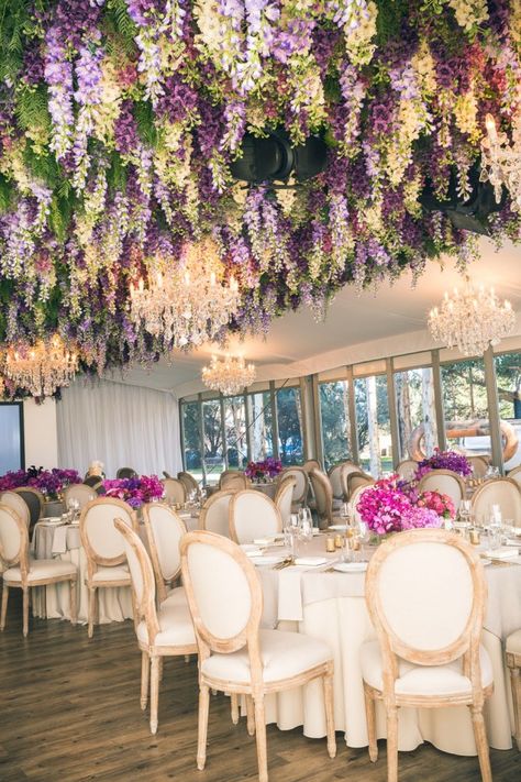 Take your wedding décor to new heights by hanging centrepieces from the ceilings. Be inspired and ensured your wedding will be a cut above the rest. Garden suspended from the ceiling, purple, white flowers and foliage Lupine Wedding Decor, Lupine Wedding, Flowers Hanging From Ceiling, Wedding Flowers Hanging, Hanging Flowers Wedding, Hanging From Ceiling, Flower Ceiling, Wedding Ceiling, Rustic Wedding Decorations