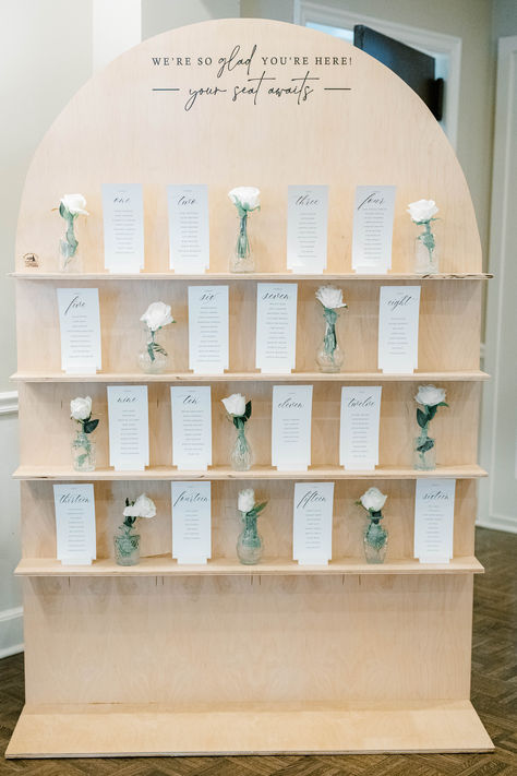 A wedding seating chart display featuring floral bud vases with delicate blooms and guest name cards, creating an elegant and creative décor element. Flower Seating Chart Wedding, Table Seating Chart Ideas, Floral Bud Vases, Wedding Seating Chart Display, Seating Chart Ideas, Chart Ideas, Traditional Roses, Wedding Palette, Creative Idea