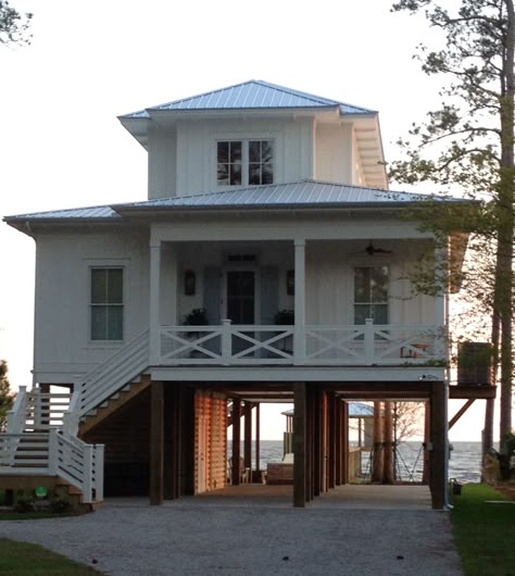 Street side view Beach House On Pilings, Cabin Modular Homes, Log Cabin Modular Homes, Beach House On Stilts, Beach Side House, Beachy Bungalow, Raised Beach House, River House Plans, Beach House Flooring