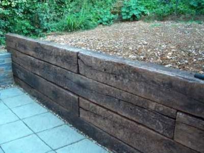 railway sleeper retaining wall - Google Search Railroad Tie Retaining Wall, Sleeper Wall, Sleeper Retaining Wall, Sleepers In Garden, Wood Retaining Wall, Retaining Wall Design, Retaining Wall Ideas, Building A Retaining Wall, Garden Retaining Wall