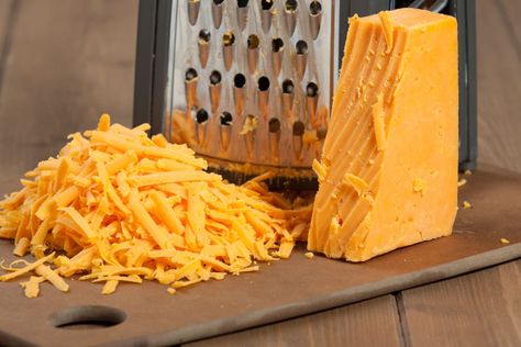 You've Been Grating Cheese Wrong Your Entire Life | Kitchn Red Leicester Cheese, Grating Cheese, Jenny Craig, Block Of Cheese, Calorie Meals, Cheese Grater, Cooking Ingredients, Grated Cheese, Cheese Ball