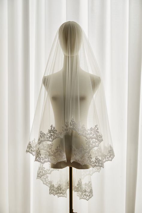 Elegant venice lace veil, it is made with scallop venice lace and soft tulle which allowing your dress to see through. The pattern is designed with delicate scalloped floral and leaf lace edge. Brides can wear the veil in mantilla or drop style.  A sewn metal comb is on it. It will secure the veil on the head. Please contact us if you do not need it. We can make it a mantilla veil ,1 tier, this link please: https://www.etsy.com/listing/1628309150/lace-edge-bridal-veil-mantilla-lace?ref=listings_ Veils Bridal Fingertip Lace, Wedding Veil Floral Lace, Lace Drop Veil, Detailed Wedding Veil, Italian Lace Veil, Vintage Wedding Veils, Veil Aesthetic, Bridal Veil Blusher, Vintage Wedding Veil