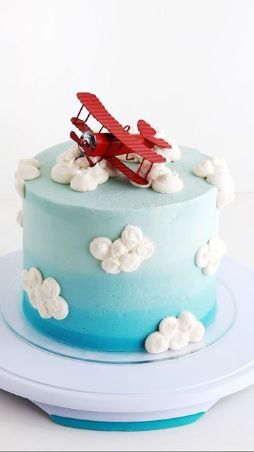 Sugar & Sparrow on Instagram: "A birthday cake for my airplane obsessed boy who turns TWO today 🤯 ⁣love celebrating my sweet Theo 🥳 ⁣ Airplane topper: @amazon⁣ Clouds: @wiltoncakes tip 1A⁣ Sky Ombré: @americolor Wedgewood + Peacock ⁣ ⁣ #birthdaycake #cakedecorating #cakeideas #cakesofinstagram #2ndbirthdaycake #airplanecake #kidsbirthdaycake #homebaked #bakinglove #cakes #funfetticake #bluecake #ombrecake #ombre #buttercreamcake⁣" Airplane First Birthday Party Cake, Aviation Birthday Cake, Diy Airplane Cake, Airplane Bday Party, Airplane Bday Cake, Time Flies Birthday Party Cake, Airplane Pull Apart Cupcakes, Two Fly Birthday Cake, Airplane Birthday Party Cake