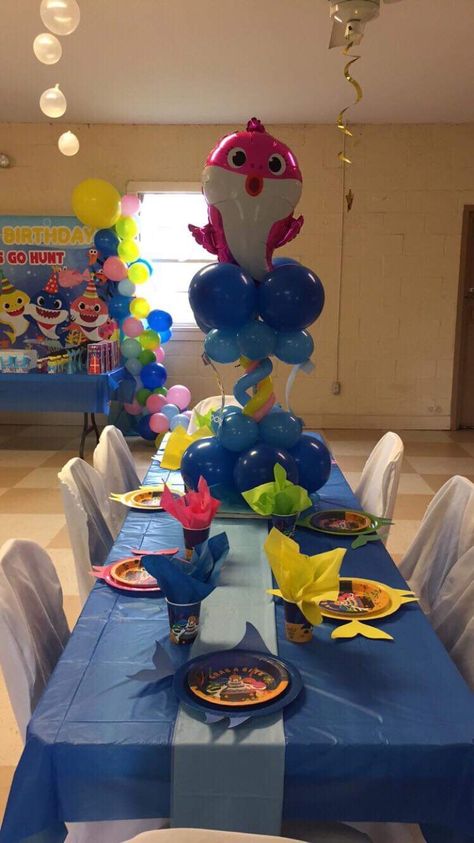 Baby shark table Baby Shark Table, Baby Shark Centerpiece Ideas, Mommy Shark, Baby Mommy, Shark Themed Birthday Party, Shark Birthday Party, Shark Party, King Baby, Shark Birthday