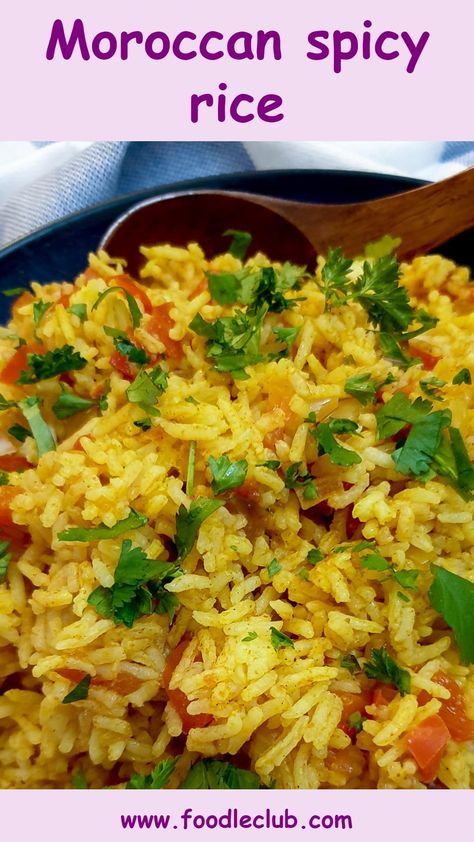 A dish of spicy rice with a wooden spoon. Medeteranian Side Dishes, Middle East Rice Recipes, Moroccan Rice Recipe, Spicy Rice Recipes Easy, Rice With Vegetables Recipe, Spiced Rice Recipes, Morracon Recipes, Middle Eastern Rice Recipes, Easy Rice Dinners