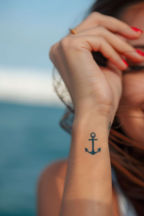 Looking for stunning wrist tattoo design ideas?! This anchor wrist tattoo is TOO gorgeous. From subtle and elegant to bold and creative, find the perfect wrist tattoo to match your style. Anchor Tattoo Placement For Women, Anchor Tattoo Designs For Women, Hope Anchor Tattoo, Anchor Wrist Tattoo, Anchor Tatoos Woman, Fineline Anchor Tattoo, Navy Anchor Tattoos For Women, Compass Anchor Tattoo Design, Small Anchor Tattoos For Women