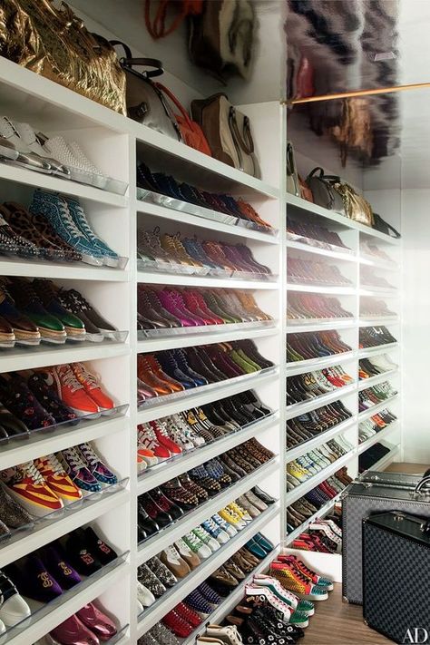 Colorful sneakers line the shoe closet of Elton John and David Furnish’s Los Angeles home. Martyn Lawrence Bullard Design, Room Shoe, Organiser Son Dressing, Shoe Storage Small Space, David Furnish, Sneaker Storage, Celebrity Closets, Shoe Storage Ideas, Shoe Organization