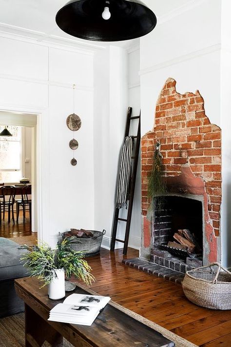 a creative asymmetrical red brick fireplace is a unique feature to go for, it's a bold solution that looks rough and unusual Exposed Brick Fireplace, Brick Finishes, Red Brick Cottage, Miners Cottage, Exposed Brick Fireplaces, White Wash Brick Fireplace, Country Style Magazine, Red Brick Fireplaces, Brick Fireplaces