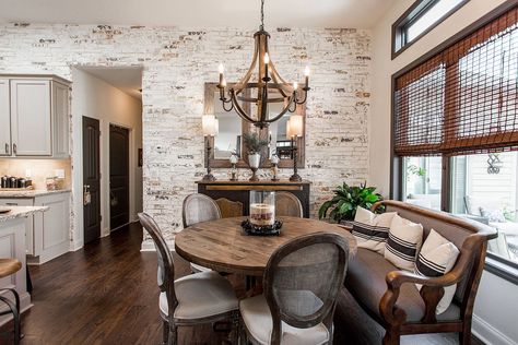 Imperfections of the whitewashed brick wall accentuate the beauty of this dining room - Decoist Brick Dining Room Wall, Whitewashed Brick Wall, Brick Wall Dining Room, Brick Dining Room, Wall Dining Table, Whitewashed Brick, Faux Brick Wall Panels, Natural Dining Room, Dining Room Accent Wall