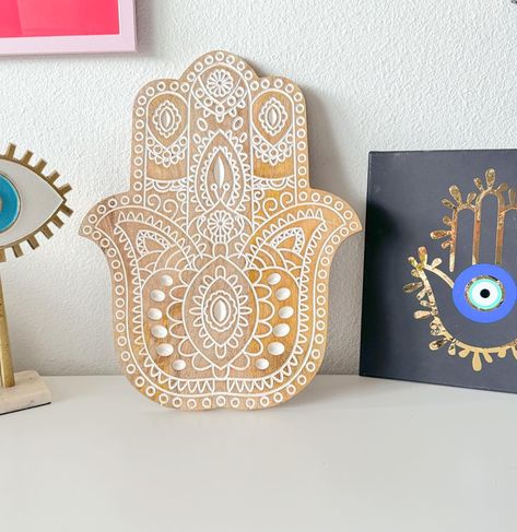 Just Landed! Bringing a touch of tradition and charm to my space with this beautiful Hamsa hand decor. 🧿✨ #hamsahand #smallbusinessowner #evileye #wallart #TeamUSA #backyardgarden #canvasart #wooden Hand Decor, Prayer Corner, Meditation Rooms, Natural Aesthetic, My Space, Hamsa Hand, Wooden Decor, Sacred Space, Aesthetic Design