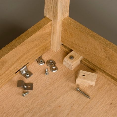 Many woodworkers have learned the hard way not to glue or screw a solid wood tabletop to its base. This can be a painful lesson in wood movement. Wood Farnichar, Fine Woodworking Furniture, Wood Joints, Free Woodworking Plans, Router Woodworking, Learn Woodworking, Wood Joinery, Wood Plans, Wood Working For Beginners