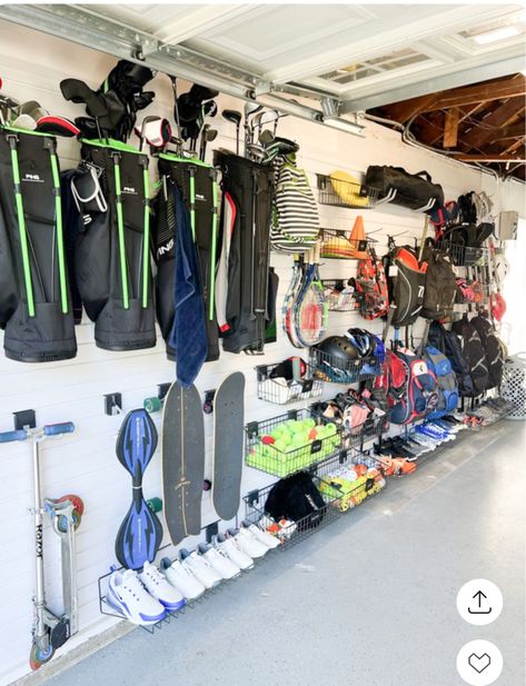 Garage Organization Ideas Sports Equipment, Garden Garage Storage, Hang Stroller In Garage, Gear Garage Organization, Baseball Organization Ideas Garage, Baseball Bag Storage Garage, Garage Baseball Organization, Scooter Organization In Garage, Sport Storage Garage