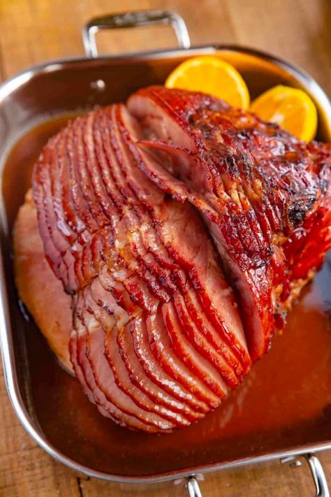 Baked Ham with Brown Sugar Glaze made with brown sugar, orange juice, honey, and spices is the PERFECT sweet and savory holiday dinner, and bakes in only 90 minutes! Orange Juice Glaze For Ham, Baked Ham With Coke And Brown Sugar, Ham Glaze With Orange Juice, Orange Juice Ham Glaze, How To Cook A Ham, Honey Baked Ham Glaze, Honey Baked Ham Copycat, Ham Glaze Recipe Brown Sugar, Baked Ham Glaze