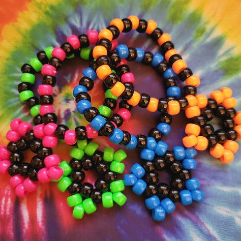 Bundle Of 4 Kandi Star Bracelets As Shown -Handmade By Me New No Tags -Made With Plastic Pony Beads And String -Kandi Stars Measure 1.83 In X 1.83 Inches -Bracelets Are 30 Beads Around There Are Also Matching Earrings Available In My Closet For Sale. Tags: Edc, Edm, Rave, Music Festival, Kandi, Plur, Kawaii, Music Festival, Electric Daisy, Coachella, Pride, Kandi Star Bracelets, Halloween, Cosplay, Y2k, Rave Gear, Retro, Kandi Trading, Kandi Bracelets, Punk, Neon, Vibrant, Gift, Dance, Techno, R Scenecore Kandi, Kandi Cuff Ideas, Pride Kandi, Kandi Star, Festival Kandi, Kawaii Music, Scene Bracelets, Bracelets Halloween, Star Bracelets