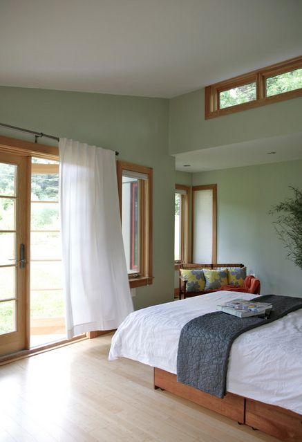 Peacefully designed bedroom with green walls Feng Shui Bedroom Layout, Honey Oak Trim, White Curtains Bedroom, Green Bedroom Walls, Light Green Walls, Feng Shui Bedroom, Oak Trim, Wood Bedroom, Bedroom Layouts