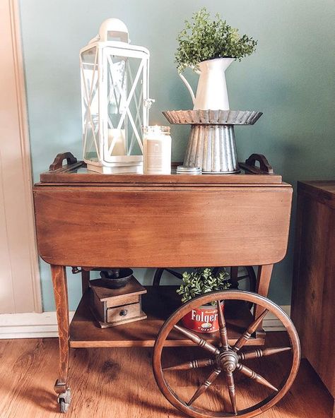 Antique tea cart decor. One of my favorite things in our living room! Tea Cart Styling, How To Style A Tea Cart, Tea Cart Decor Display, How To Decorate A Tea Cart, Vintage Tea Cart Decor, Tea Cart Decor, Tea Cart Ideas, Wood Tea Cart Makeover, Antique Tea Cart Updated