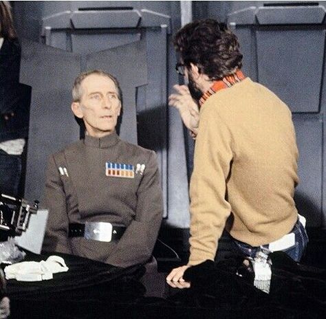 Grand Moff Tarkin (Peter Cushing) takes direction from George Lucas on the set of "Star Wars" (1977) Wilhuff Tarkin, Grand Moff Tarkin, Hammer Horror, Peter Cushing, Star Wars Episode Iv, Christopher Lee, Star Wars 1977, Star Wars Trilogy, Stars Wars