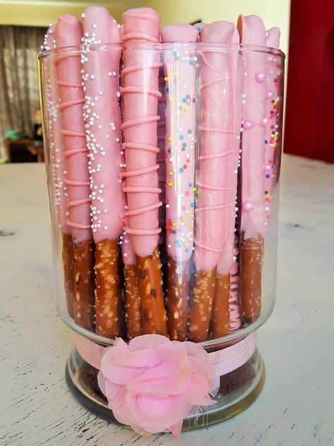 Dipped Pretzel Rods Baby Shower, Pink Chocolate Dipped Pretzels, Candy Covered Pretzels Rods, Pretzel Rods Dipped Valentines, Pink Dipped Pretzels, Pretzel Rods Dipped Birthday Parties, Pink Pretzel Rods, Baby Shower Pretzel Rods, Pink Party Snacks