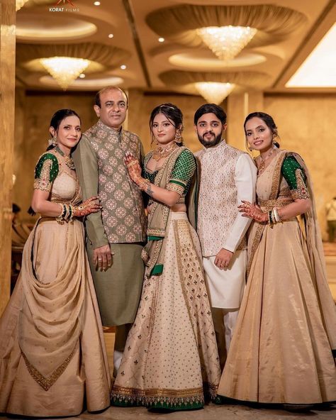 This family's color-coordinated outfit game is on point. 👌Agree? If you too planning for color-coordinated dress theme for wedding festivities then save this post for inspiration. 😍 Outfit: @jiviva_ HMUA: @sejal_savaliya22 & team Photography: @koratfilms #indianwedding #wishnwed #lehenga #lehengacholi #lehengalove #lehengas #lehengablousedesigns #lehengasaree #lehengainspiration #lehengagoals #lehengacollection #ehengadesigns #lehengastyle #lehengacholionline #designerlehenga Indian Family Wedding Outfits, Indian Bridal Family Outfits, Family Outfits For Wedding Indian, Family Same Dress Indian Wedding, Family Traditional Outfits Indian, Indian Wedding Family Outfits, Matching Family Outfits For Wedding, Family Photo Outfits Indian, Family Function Outfit