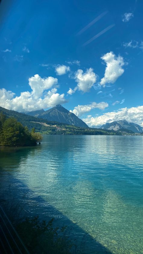 Mountain. lake. train ride. Switzerland. Travel. Sky Swiss Alps Aesthetic Summer, Interlaken Aesthetic, Interlaken Switzerland Aesthetic, Switzerland Beach, Switzerland Aesthetic Wallpaper, Swiss Alps Aesthetic, Switzerland In June, Swiss Alps Summer, Life In Switzerland