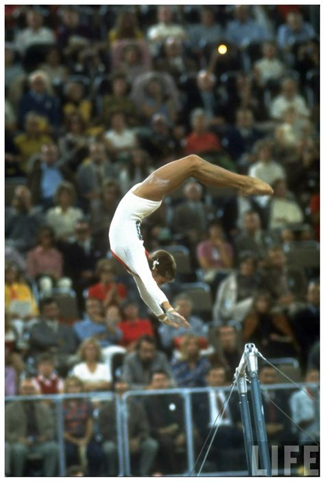 Olga Korbut doing Korbut Flip uneven bars at the Summer Olympics 1972 Photo John D Summer Olympics Party, Olga Korbut, Sport Poses, Gymnastics Women, Famous Gymnasts, 1984 Winter Olympics, Alina Kabaeva, Gymnastics Moves, Nadia Comaneci