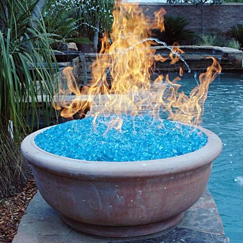 A fire pit using "fire glass." Our local recycle center crushes all glass bottles they receive, yielding a colorful, pebbly mix...and they give it away to the public. Yet another project... Have Inspiration, Fire Glass, Kit Home, Cool Stuff, Tiny Homes, Outdoor Projects, A Fire, Garden And Yard, My Dream Home