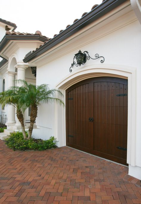 Mediterranean Fence Ideas, Modern Mediterranean Garage Doors, Florida Garage Doors, Front Door And Garage Door Match, Spanish Style Garage, Mediterranean Garage, Tuscan Home Exterior, Mediterranean Front Doors, Mediterranean Exterior Design