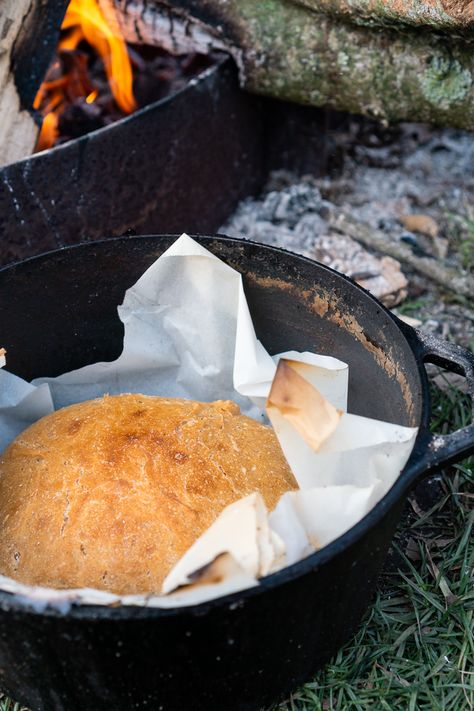 This simple loaf is baked in a Dutch oven and produces a moist crumb with a crisp exterior. Minimal prep and mess make this an excellent camping bread. Making Bread Over A Fire, Dutch Oven Bread Campfire, Campfire Bread Dutch Ovens, Camp Fire Bread, Dutch Oven Bread Camping, Bread Over Fire, Camp Bread, Camping Bread, Campfire Bread