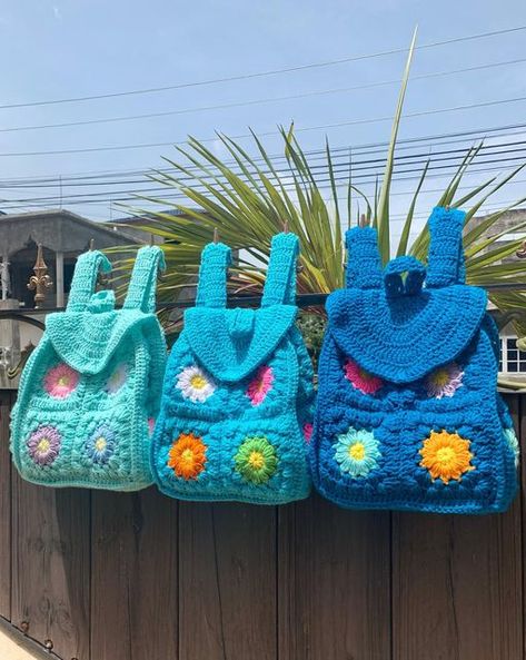 🌿 Dandelion 🌿 on Instagram: "I just love how unique handmade goods are. Every piece is not quite exactly the same but beautiful nevertheless. 💙 . The Dandelion Crochet Backpack: . $10,000 JMD // USD prices are on website (link in bio) . #handmade #instashop #crochet #onlineshopping #crochetfashion #shoponline #shopping #etsy #fashion #crocheting #fashiondaily #crochetersofinstagram #etsyfinds #shopsmall #etsygifts #craft #ilovecrochet" Back Bag Crochet, Cute Crochet Backpack, Unique Crochet Bags, Crochet Knapsack, Crochet Rucksack, Crochet Granny Square Backpack, Crochet Pocketbook, Crochet Bookbag, Crochet Kids Backpack