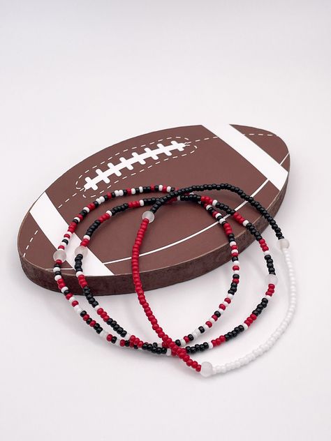 Handmade Atlanta Falcons beaded bracelets. *Bracelets are sold as a stack of three* All bracelets are roughly 6.5 inches and made with 2mm beads.  If you would like a different length please let us know! *To preserve its quality, roll bracelet on and off gently* Nfl Jewelry, 2mm Beads, Gifts For Football Fans, Seed Bead Bracelet, Bracelets Handmade Beaded, Jewelry Boho, Seed Bead Bracelets, Atlanta Falcons, Bracelet Handmade