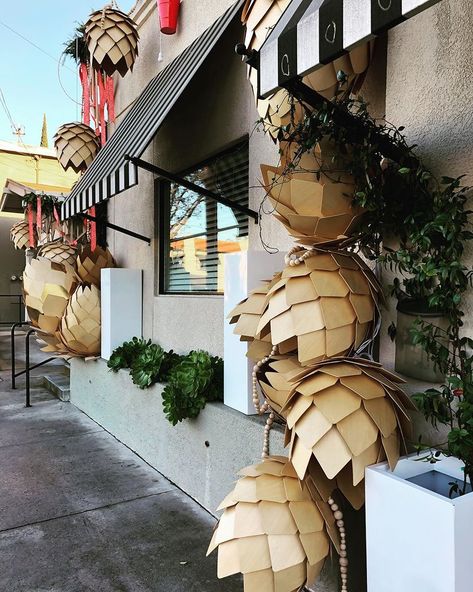 Caught the woodworker starting this display a week ago from wood scraps from his shop but lots added since then — all with lights too. (He… | Instagram Christmas Installation, Cardboard Art Sculpture, Windows Display, Cozy Christmas Decor, Wood Scraps, Christmas Shows, Cardboard Art, Orange Garland, Black House Exterior