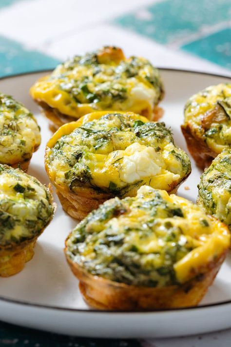 These Zucchini Egg Muffins are the perfect make ahead breakfast and they're freezer-friendly! They're made with sauteed zucchini, feta cheese, and lots of fresh herbs. The prep is super easy and you can serve them for breakfast or as a snack on-the-go. They're delicious both hot and cold, healthy, quick, and easy! Zucchini Feta Muffins, Zucchini Egg Bites, Zucchini Egg Muffins, Egg Zucchini, Pesto Tortellini Salad, Zucchini Egg, Sausage And Veggies, Baked Egg Cups, Breakfast Egg Muffins