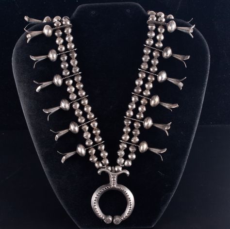 "Vintage 1950's Sterling Silver Navajo Sand Cast Squash Blossom Necklace 137.6g Metal Information: Sterling Silver Total Weight: 137.6g Necklace Width: 7.7mm Necklace Length: 26\" Large Naja Dimensions: 2\" x 1.5\" Blossom Dimensions: 12mm x 45mm Circa: 1950's Estimated Retail Price: $3000.00 OUR PRICE: $2400.00 44632" Vintage Squash Blossom Necklace, Naja Necklace, 1940s Engagement Ring, Manitou Springs, Into The West, American Indian Jewelry, Sand Casting, Jewelry Website, Squash Blossom Necklace