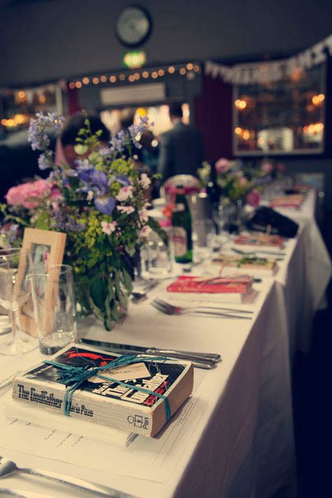 Place settings that each feature one used book. | 19 Ways To Have The Literary Wedding Of Your Dreams Wedding Book Decorations, Book Wedding Favors, Literary Wedding Theme, Book Wedding Centerpieces, Schoolhouse Wedding, Book Lovers Wedding, Wedding Table Planner, Book Favors, Book Centerpieces