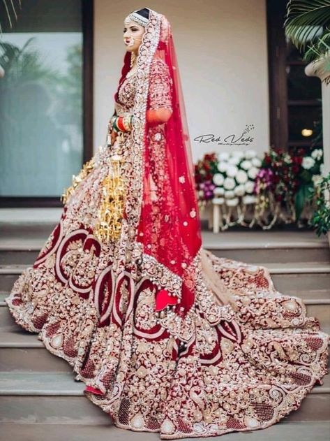 Looking for Long trail Bridal Lehengas ? Check out more such bridal fashion inspiration on the blog. Click on the link attached below.    #indianweddings #shaadisaga #intimateweddings #bridalfashion #bridallehenga #longtraillehenga #indianweddingtrends #extraordinarylehenga #indianbridaltrends #elegantlehenga शादी की तस्वीरें, Lehenga Bridal, Red Bridal Dress, Bridal Dupatta, Bridal Photography Poses, Wedding Lehenga Designs, Bridal Lehenga Collection, Indian Wedding Photography Poses, Designer Bridal Lehenga